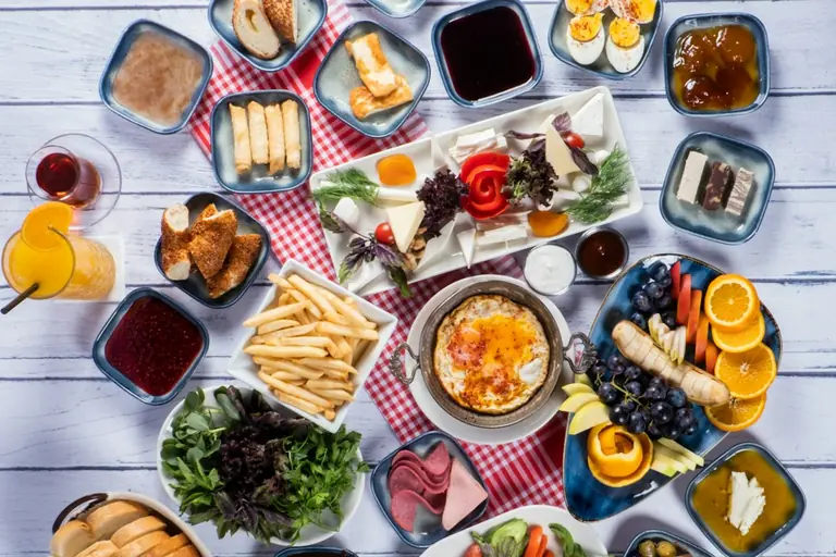 a table topped with lots of different types of food