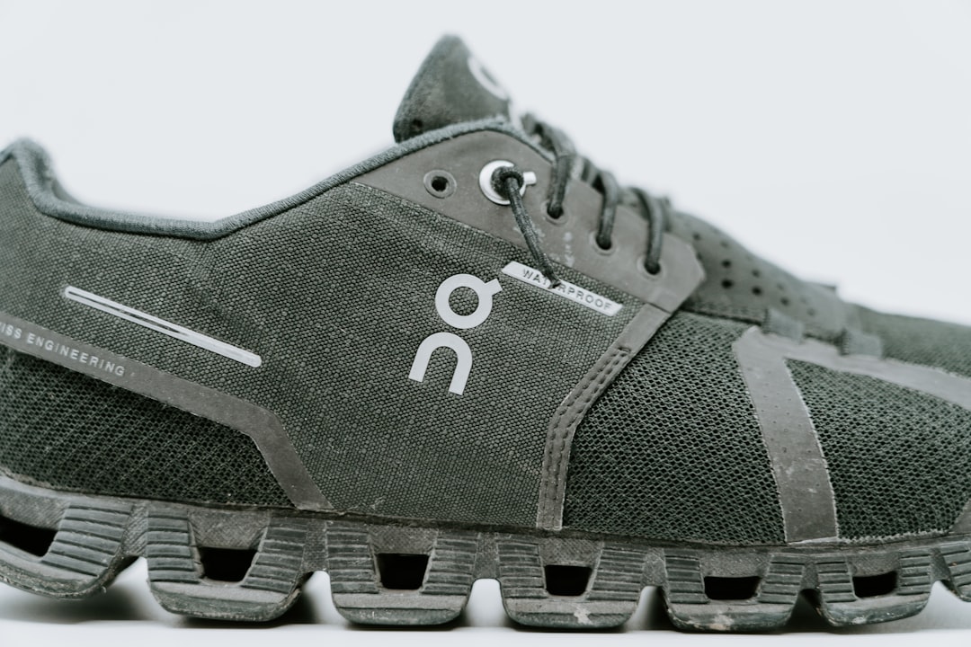 unpaired gray DQ lace-up athletic shoe